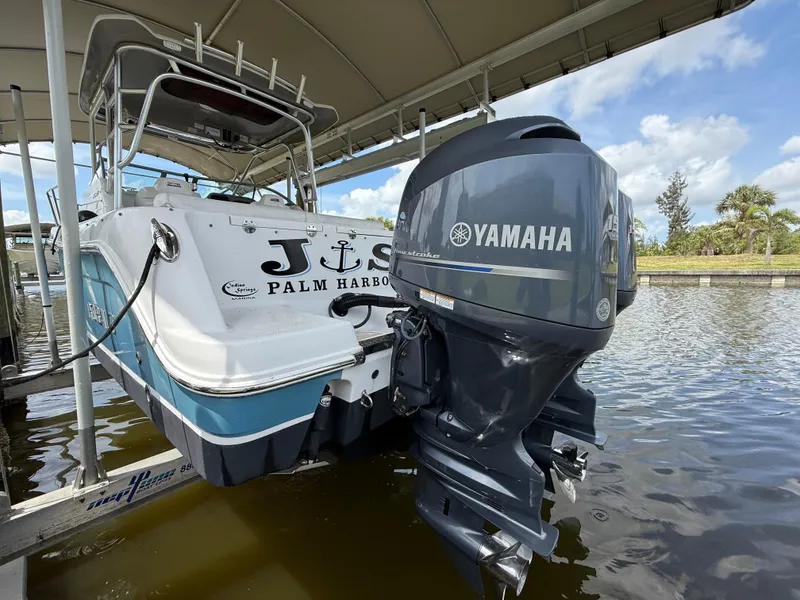 Slide: The Image of 2013 Robalo R245 Walkaround boat with Yamaha outboard motor, docked in Palm Harbor. - 8