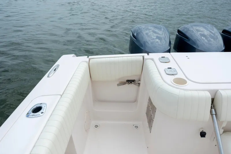 Slide: The Image of 2011 Grady-White Canyon 366 boat stern with dual outboard motors on water. - 12