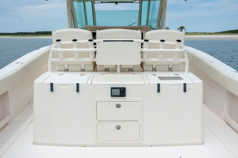 Slide: The Image of 2011 Grady-White Canyon 366 boat interior with storage compartments and seating. - 15
