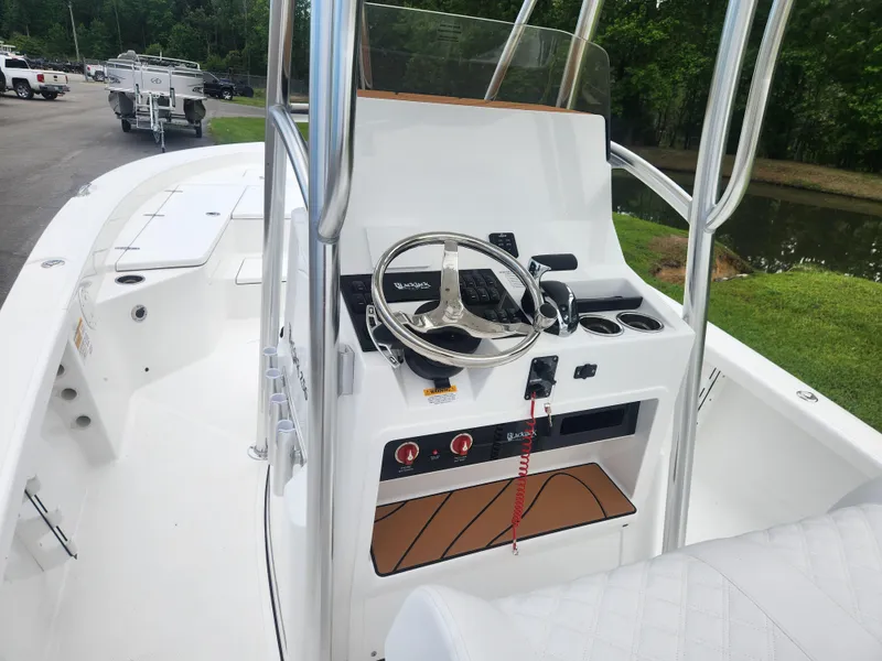 Slide: The Image of 2025 BlackJack 256 Bay boat interior with steering console and controls. - 14