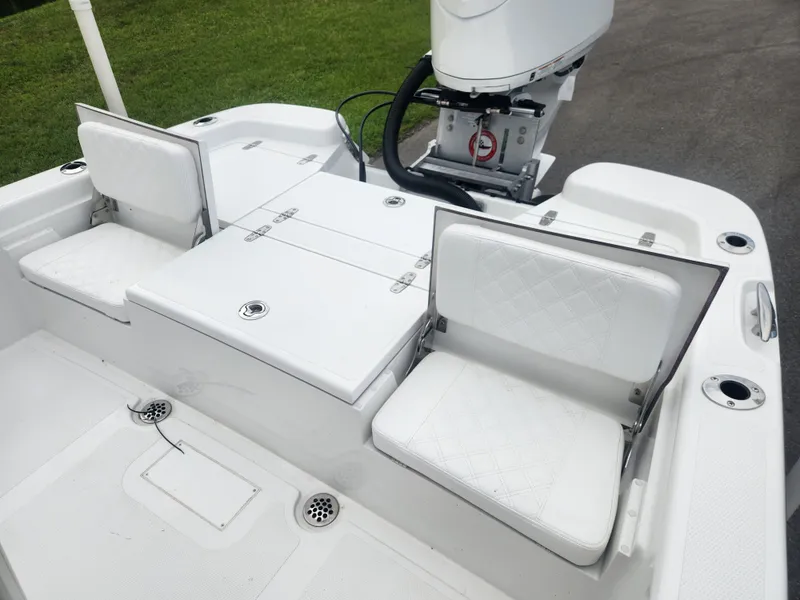 Slide: The Image of 2025 BlackJack 256 Bay boat with white seating and motor, showcasing modern design. - 18