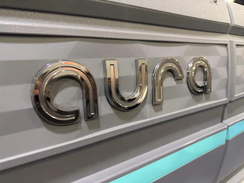 Slide: The Image of 2025 Avalon Aura 21' pontoon boat with Suzuki outboard motor on trailer. - 3