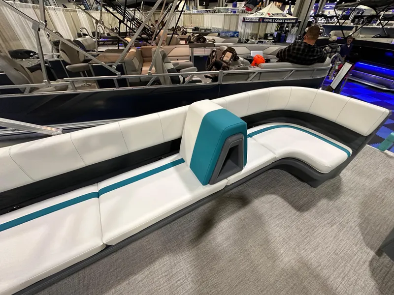 Slide: The Image of Steering console of 2025 Avalon Aura 21' pontoon boat with modern controls and seating. - 7