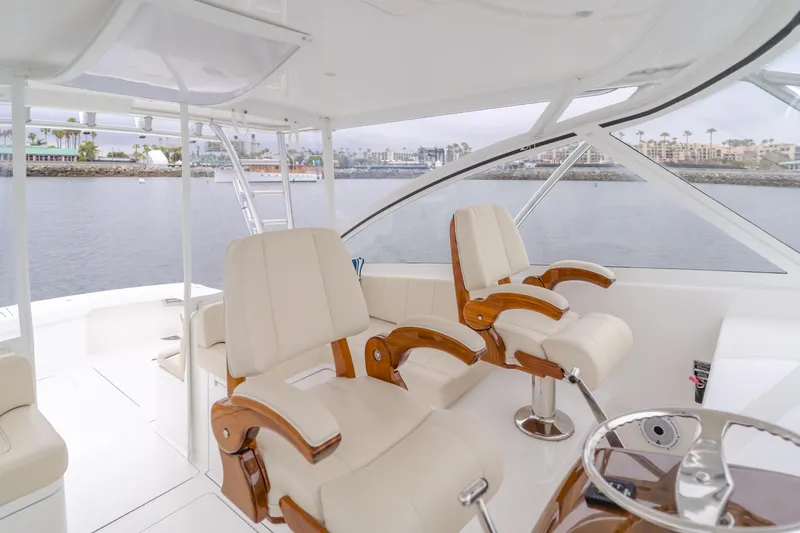 Slide: The Image of 2022 Viking 38 Open Billfish yacht interior with luxurious seating and ocean view. - 11