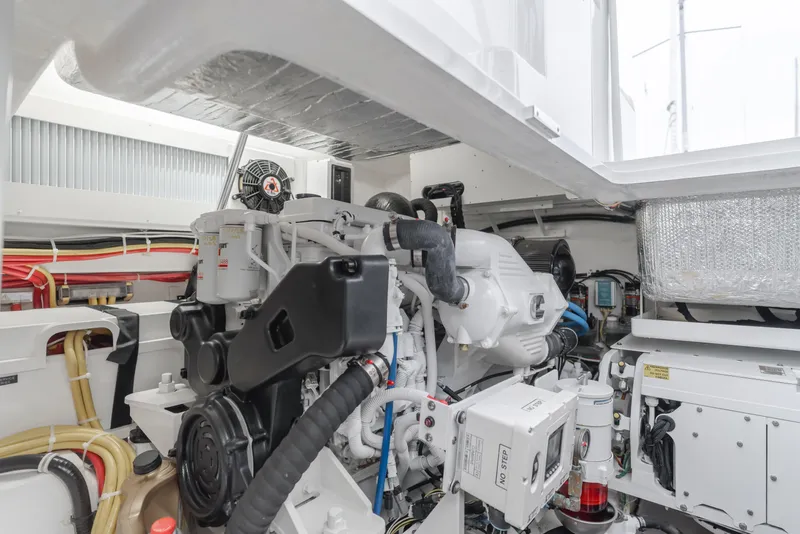 Slide: The Image of Engine room of 2022 Viking 38 Open Billfish, showcasing advanced marine machinery. - 25