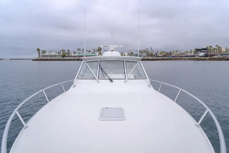 Slide: The Image of 2022 Viking 38 Open Billfish yacht on calm waters, overcast sky in background. - 28