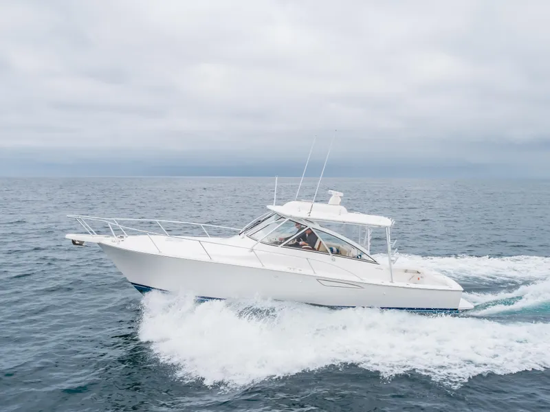 Slide: The Image of 2022 Viking 38 Open Billfish cruising on open sea under cloudy skies. - 30