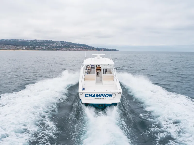 Slide: The Image of 2022 Viking 38 Open Billfish cruising on open water, rear view. - 31