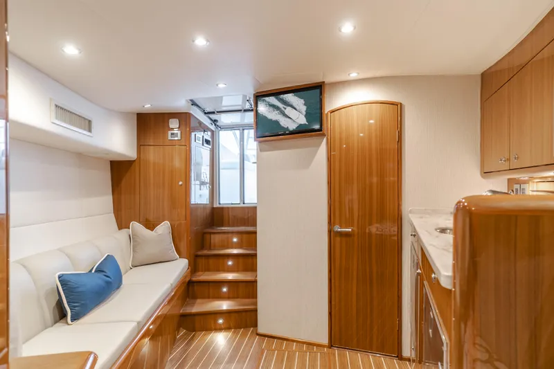Slide: The Image of Interior of 2022 Viking 38 Open Billfish yacht with elegant wood finish and modern amenities. - 6