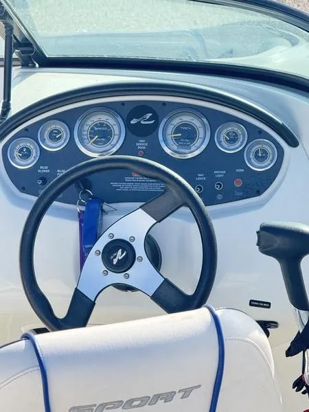 Slide: The Image of Steering wheel and dashboard of 2012 Sea Ray 185 Sport boat. - 10