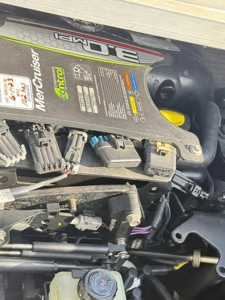 Slide: The Image of Engine components of a 2012 Sea Ray 185 Sport boat, featuring MerCruiser parts. - 11