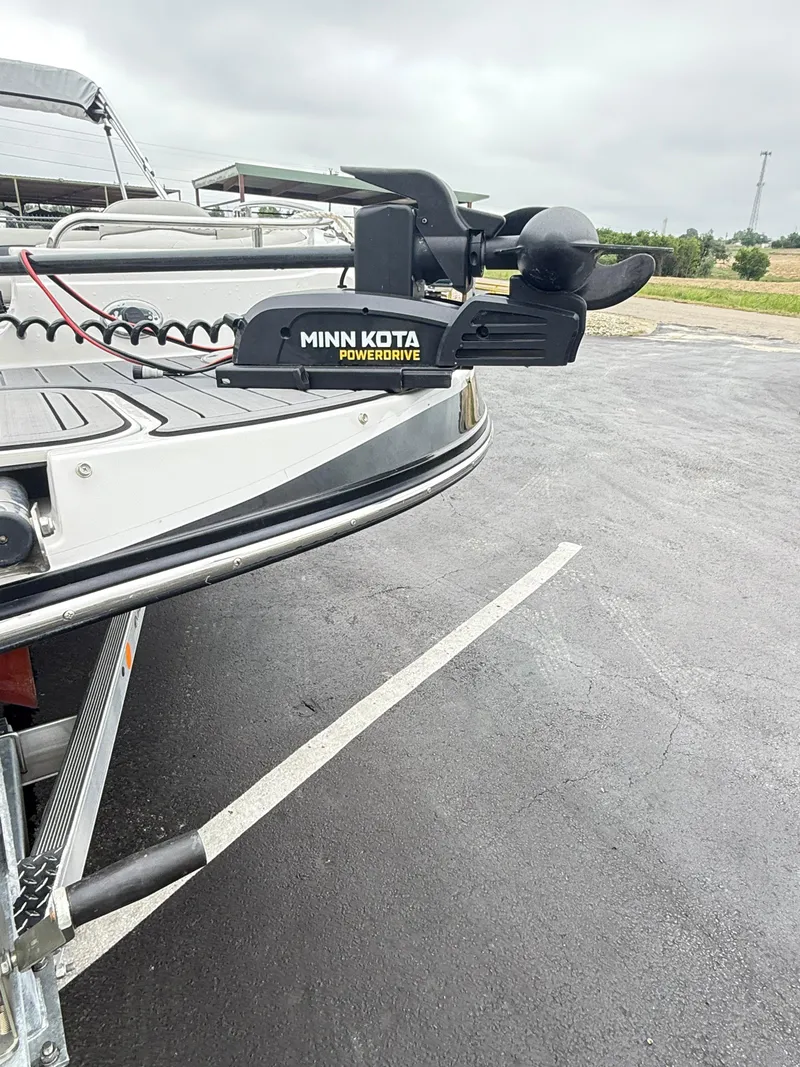 Slide: The Image of Starcraft MDX191 boat with Minn Kota PowerDrive trolling motor, 2021 model, parked on asphalt. - 11