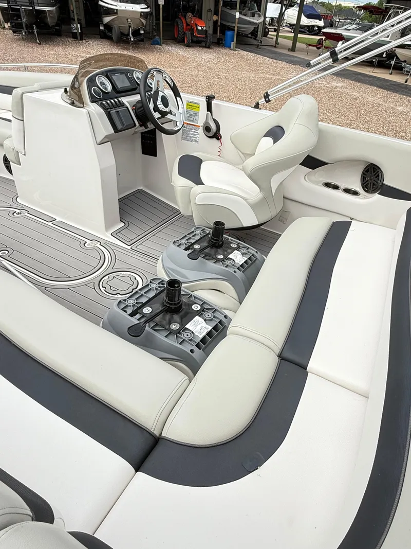 Slide: The Image of 2021 Starcraft MDX191 boat interior with steering console and seating area. - 17