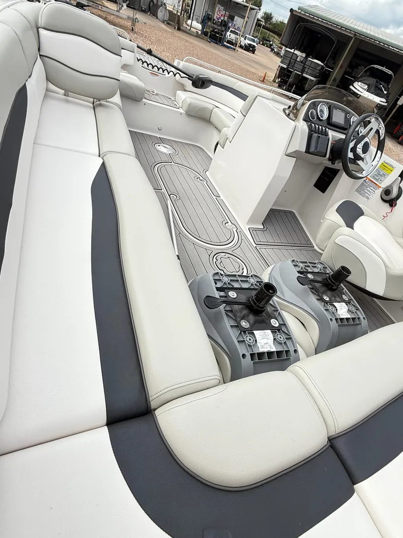 Slide: The Image of 2021 Starcraft MDX191 boat interior with plush seating and modern dashboard. - 19