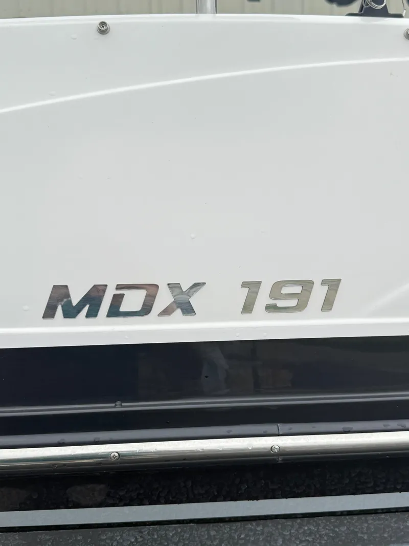 Slide: The Image of 2021 Starcraft MDX191 boat model nameplate on white hull. - 20