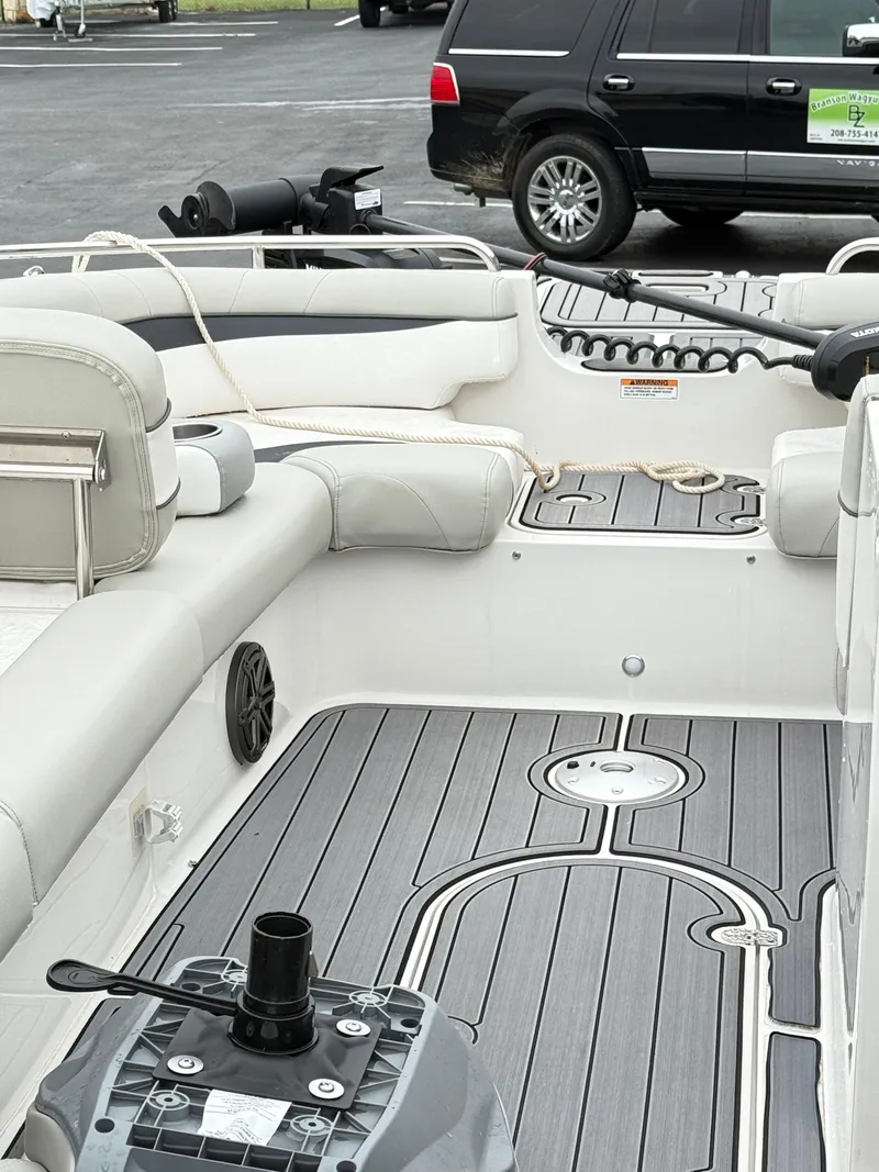 Slide: The Image of Interior of a 2021 Starcraft MDX191 boat with gray flooring and seating. - 28