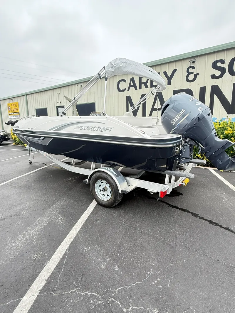 Slide: The Image of 2021 Starcraft MDX191 boat with Yamaha engine on trailer in parking lot. - 5