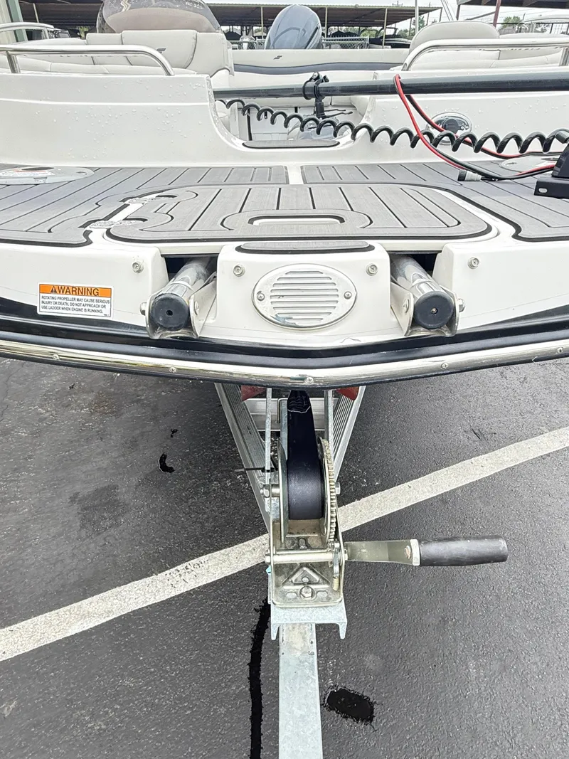 Slide: The Image of 2021 Starcraft MDX191 boat on trailer, showing bow and deck details. - 6