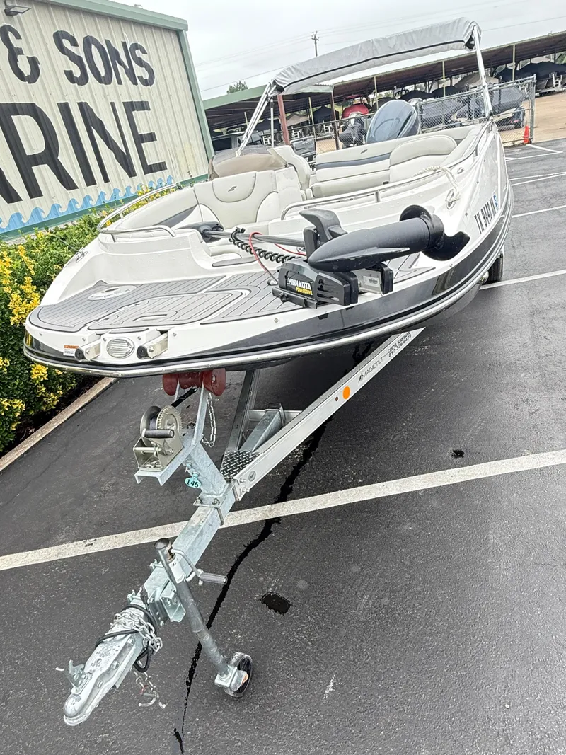 Slide: The Image of 2021 Starcraft MDX191 boat on trailer at a marine dealership. - 8