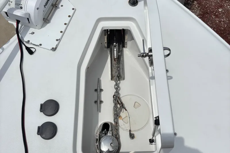 Slide: The Image of 2019 Sea Hunt Gamefish 27 anchor compartment with chain and winch system. - 13