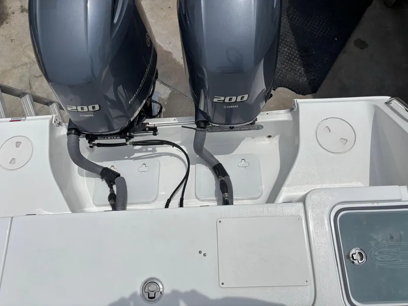 Slide: The Image of 2019 Sea Hunt Gamefish 27 with dual 200 horsepower engines, rear view. - 3