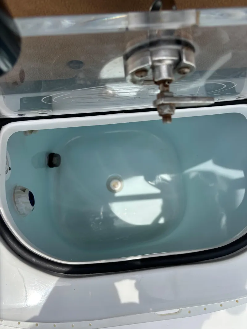 Slide: The Image of Livewell on a 2019 Sea Hunt Gamefish 27 boat, open lid view. - 5