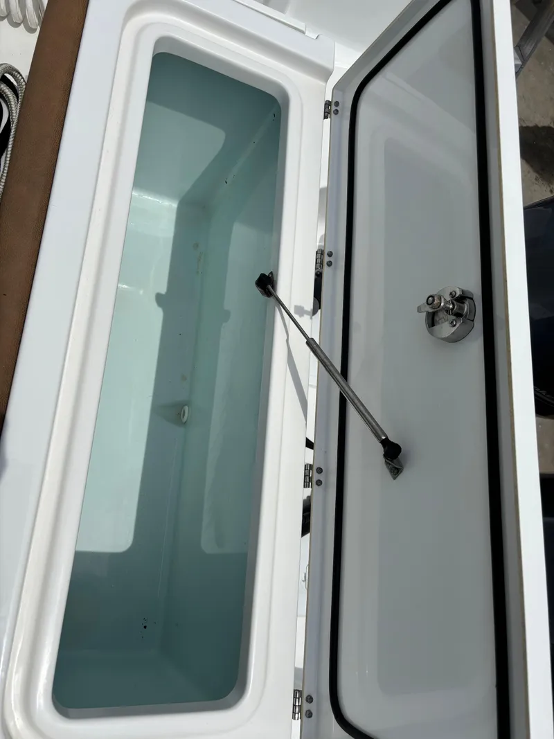 Slide: The Image of Open storage compartment on 2019 Sea Hunt Gamefish 27 boat. - 7