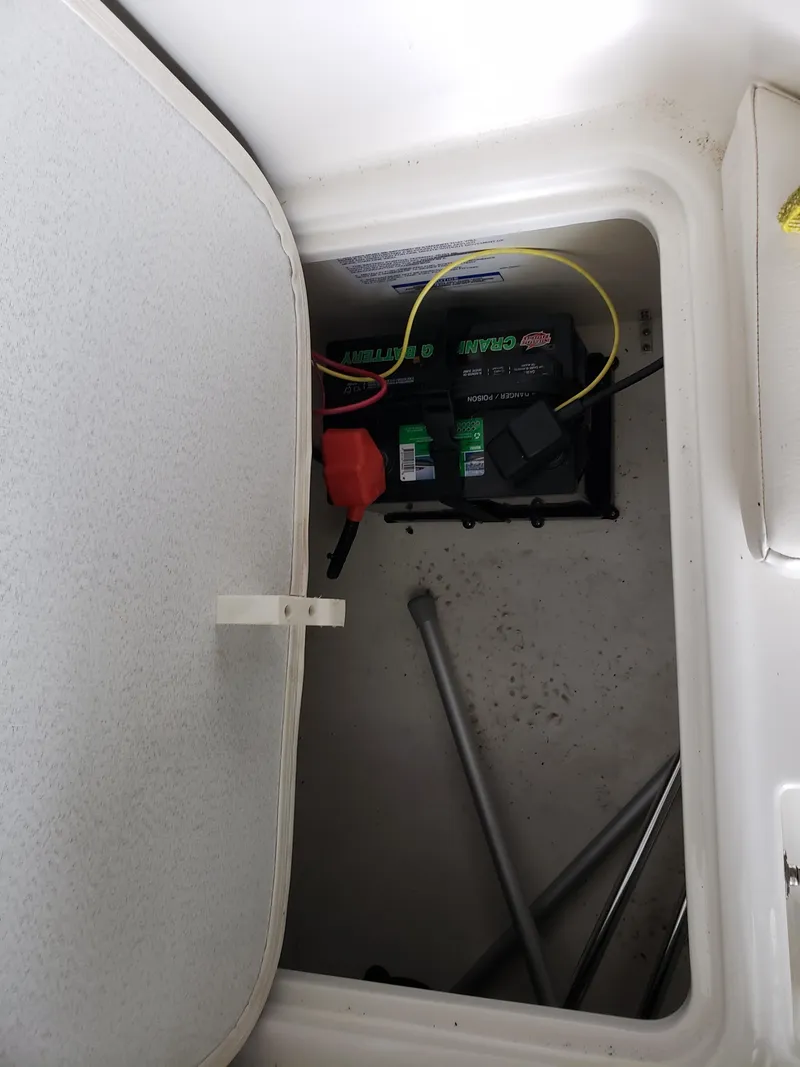 Slide: The Image of 2020 Bayliner Element E16 boat battery compartment with visible wiring. - 2