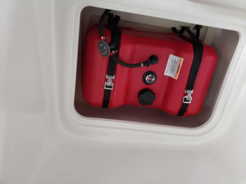 Slide: The Image of 2020 Bayliner Element E16 red fuel tank secured with straps. - 3
