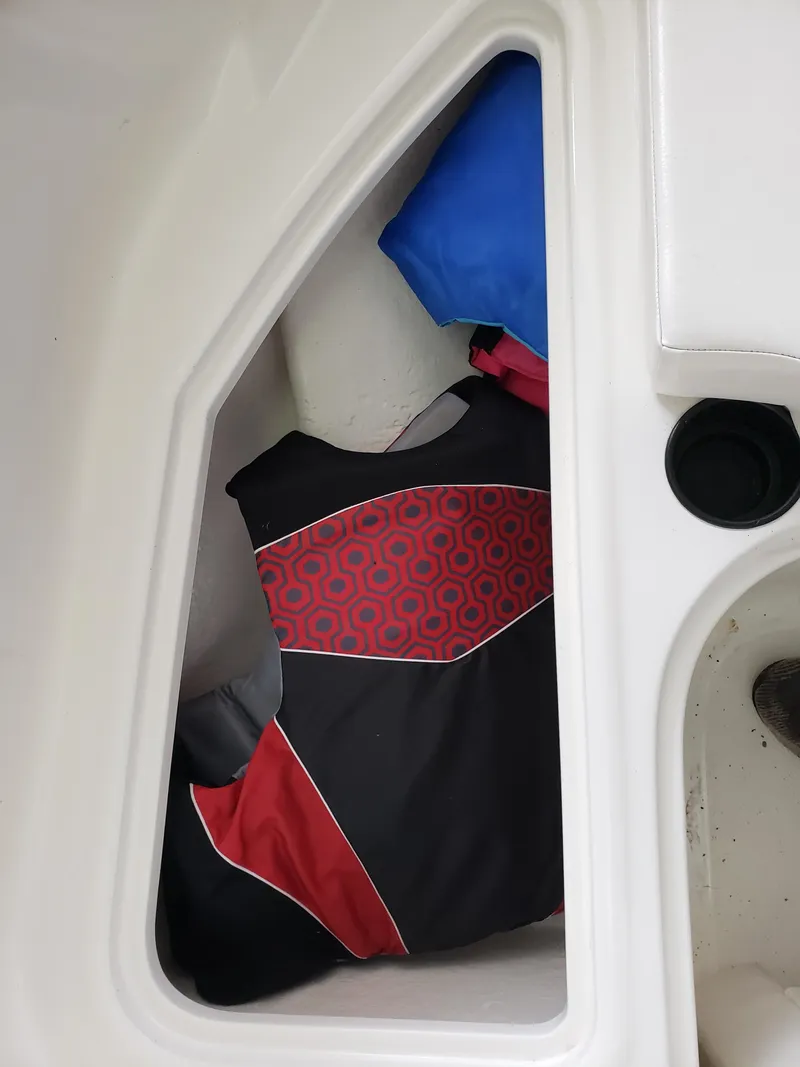 Slide: The Image of Life jackets stored in a 2020 Bayliner Element E16 boat compartment. - 5