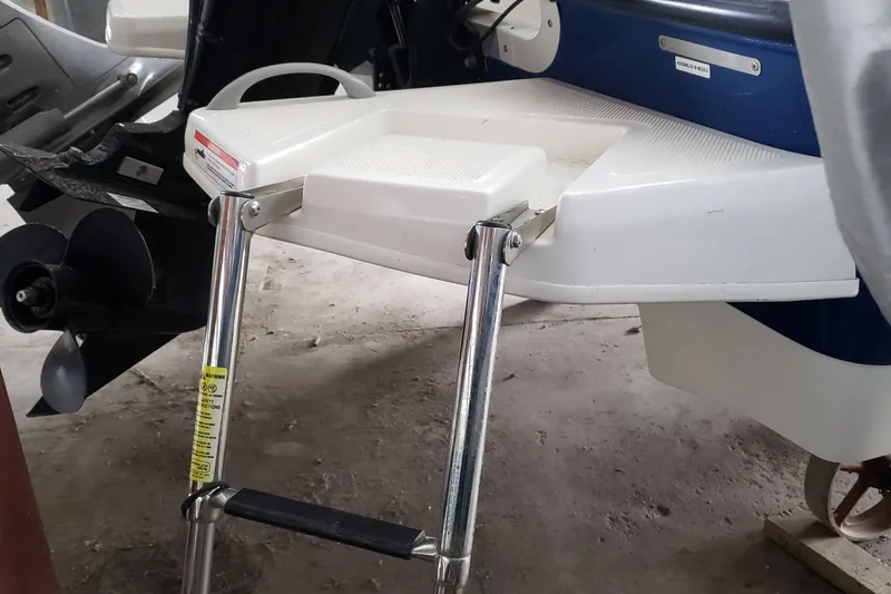Slide: The Image of 2020 Bayliner Element E16 boat with a foldable swim ladder. - 9
