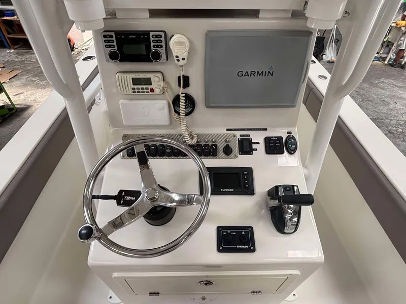 Slide: The Image of 2014 Andros Tarpon 26 boat console with Garmin navigation and steering wheel. - 11