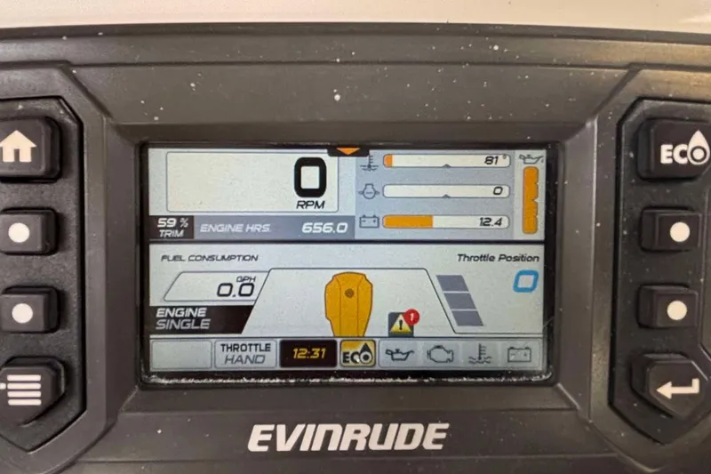 Slide: The Image of Evinrude engine display on 2014 Andros Tarpon 26, showing RPM and fuel consumption. - 12