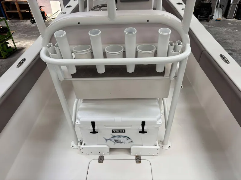 Slide: The Image of 2014 Andros Tarpon 26 boat with rod holders and Yeti cooler on deck. - 14