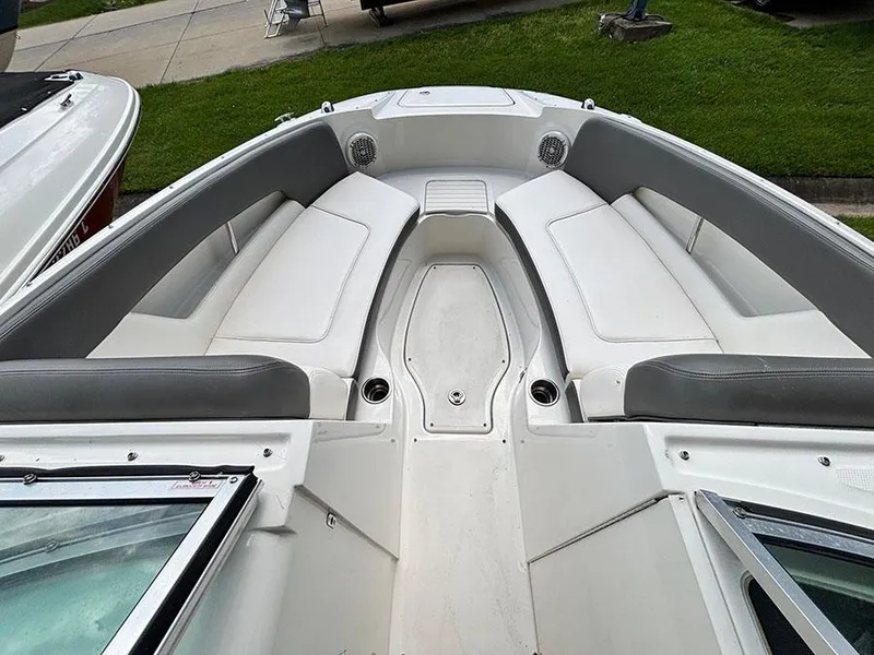 Slide: The Image of 2011 Sea Ray 240 Sundeck boat with spacious seating and sleek design. - 12