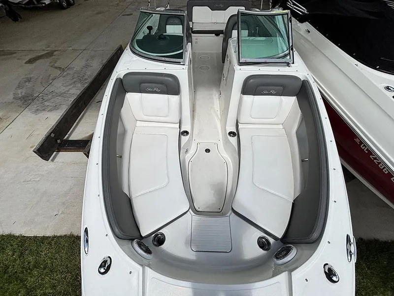 Slide: The Image of 2011 Sea Ray 240 Sundeck boat interior with spacious seating and sleek design. - 14