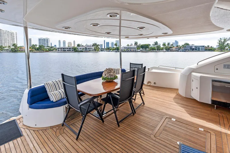 Slide: The Image of Luxury Sunseeker 75 Yacht 2006 with elegant outdoor dining area on teak deck. - 16