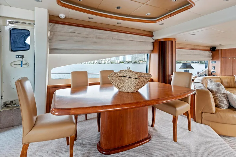 Slide: The Image of Luxurious interior of 2006 Sunseeker 75 Yacht with elegant dining area and wooden table. - 27