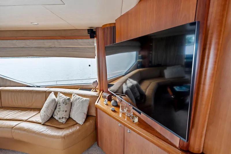 Slide: The Image of Luxurious interior of 2006 Sunseeker 75 Yacht with leather seating and large TV. - 28