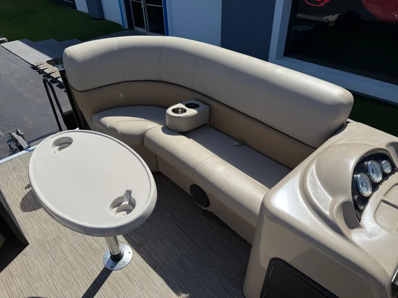Slide: The Image of 2019 Bentley Pontoons 180 CRUISE interior with beige seating and table. - 10