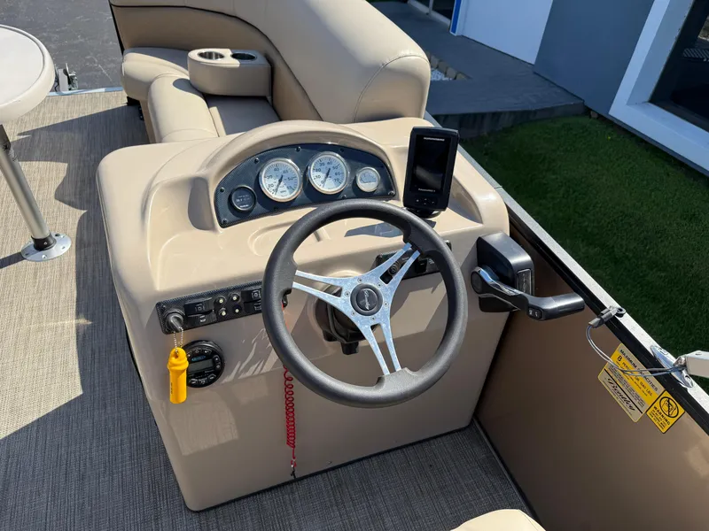 Slide: The Image of 2019 Bentley Pontoons 180 CRUISE dashboard with steering wheel and gauges. - 14