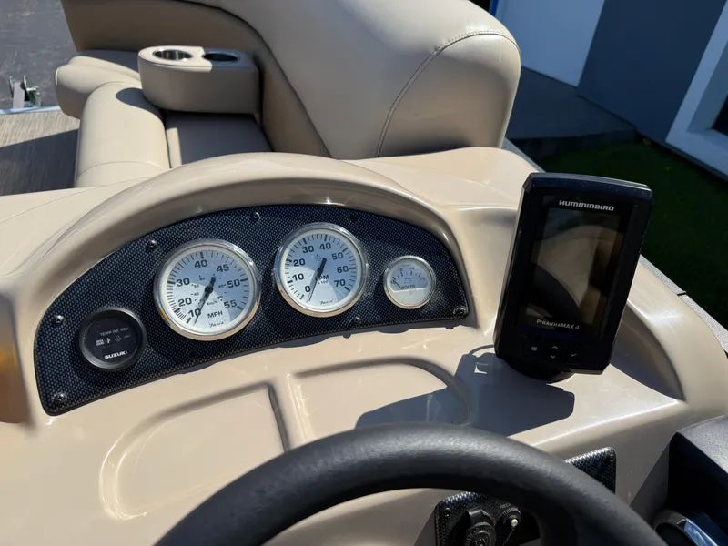 Slide: The Image of 2019 Bentley Pontoons 180 CRUISE dashboard with gauges and Humminbird device. - 17