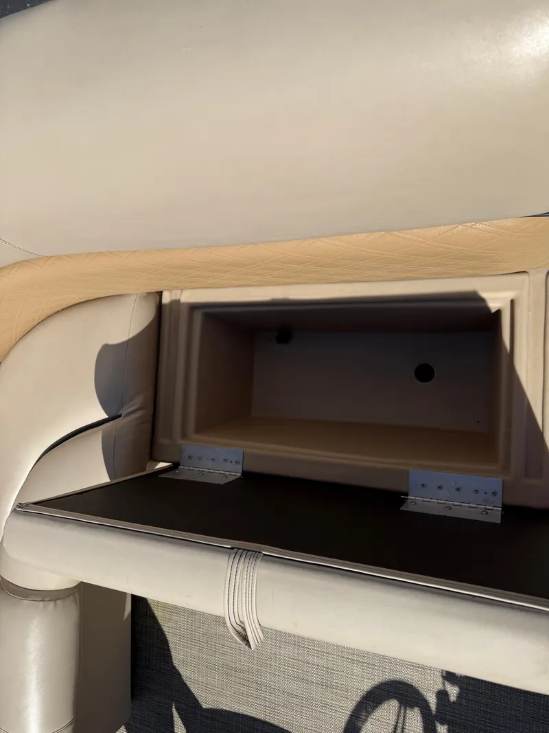 Slide: The Image of 2019 Bentley Pontoons 180 CRUISE storage compartment with beige upholstery. - 20