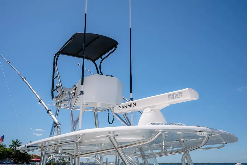Slide: The Image of 2022 Contender 39 ST boat with Garmin xHD2 radar against clear blue sky. - 27