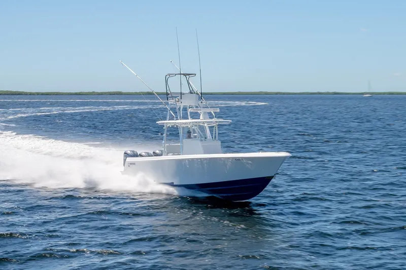 Slide: The Image of 2022 Contender 39 ST boat cruising on open water, showcasing speed and performance. - 5