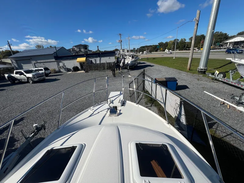 Slide: The Image of 2016 Cutwater C28 boat on display at a marina with clear blue skies. - 11