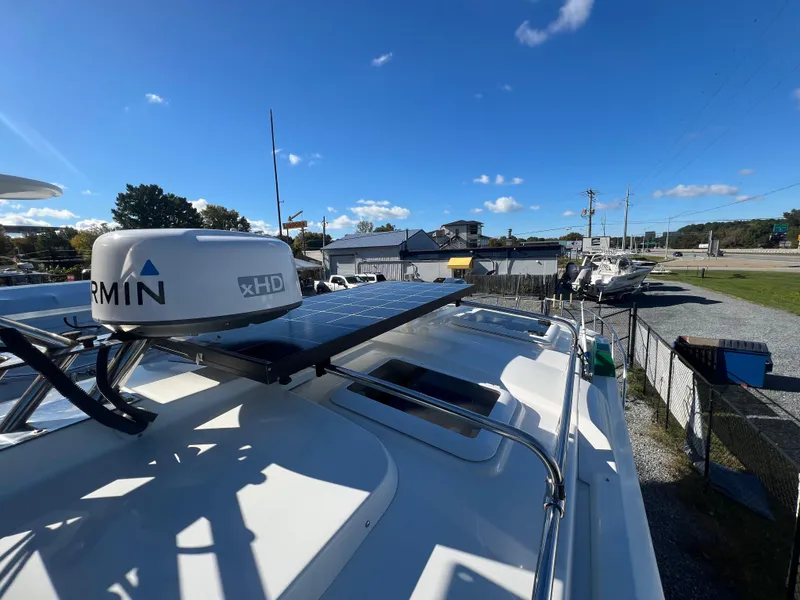 Slide: The Image of 2016 Cutwater C28 boat with Garmin xHD radar and solar panels under a clear blue sky. - 14