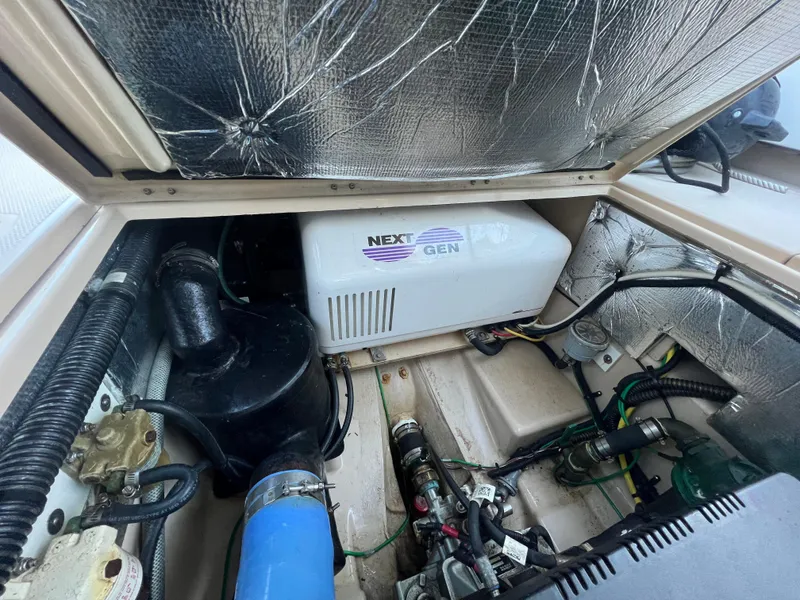 Slide: The Image of Engine compartment of a 2016 Cutwater C28 boat with Next Gen generator. - 16