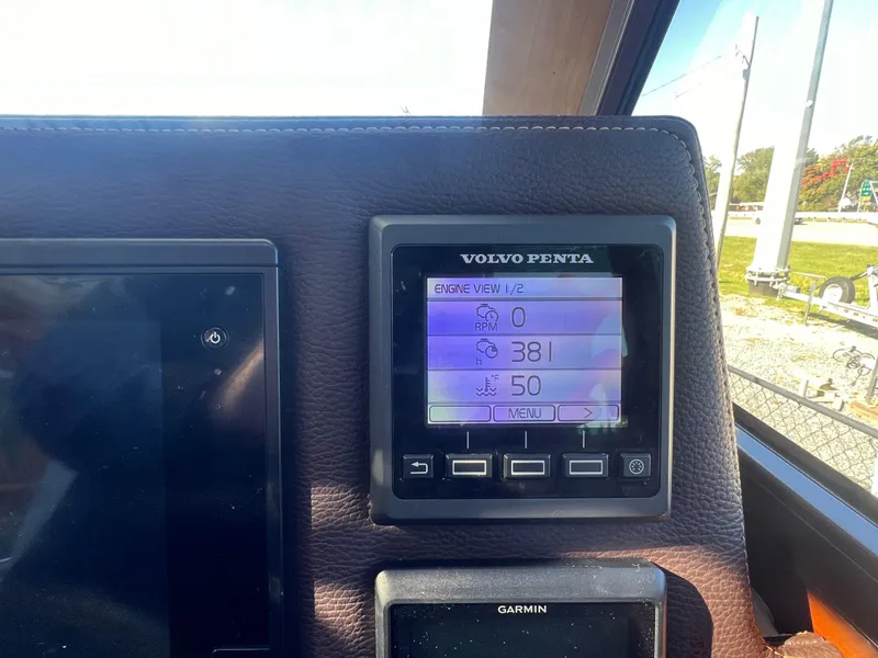 Slide: The Image of Volvo Penta engine display on 2016 Cutwater C28 boat dashboard, showing RPM and engine hours. - 26
