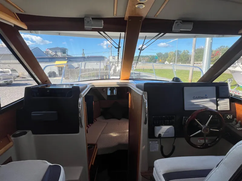 Slide: The Image of Interior view of 2016 Cutwater C28 boat cockpit with Garmin navigation system. - 37